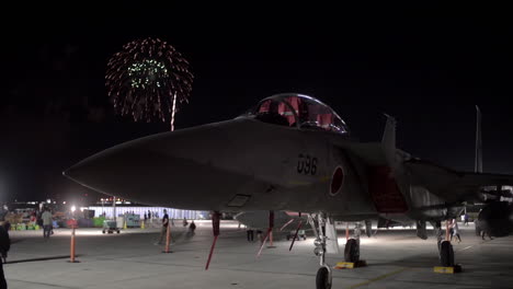 Fireworks-At-Night-Behind-A-Fighter-Jet-At-An-Airshow