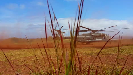 The-Sikorsky-Ch53-Helicopter-In-Action-Taking-Off-From-A-Field