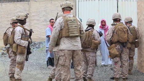 Us-Marines-And-Navy-Seals-Walk-On-Patrol-Through-A-Simulated-Arab-Village-1