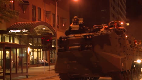 Police-And-Marines-Roll-Out-Tanks-And-Armored-Vehicles-Through-An-American-City-During-Times-Of-Public-Unrest-And-Rioting