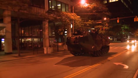 Police-And-Marines-Roll-Out-Tanks-And-Armored-Vehicles-Through-An-American-City-During-Times-Of-Public-Unrest-And-Rioting-2