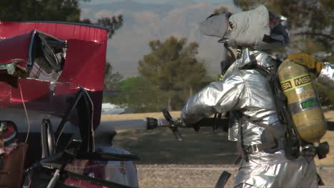 Firemen-In-Hazmat-Suits-Fight-A-Simulated-Vehicle-Fire-1