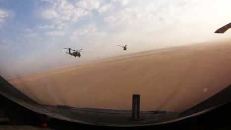 A-Squadron-Of-Helicopters-Fly-In-Formation-Over-Afghanistan-1