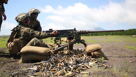 Soldiers-Engage-In-A-Live-Fire-Exercise-With-Machine-Guns-On-A-Battlefield-In-Japan
