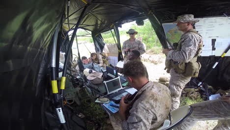 Us-Troops-At-Work-At-A-Mobile-Command-Center-In-The-Field