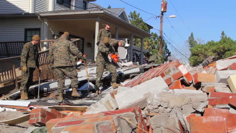 Marines-And-Army-Troops-Search-Through-Ruined-Homes-Following-Hurricane-Sandy-6