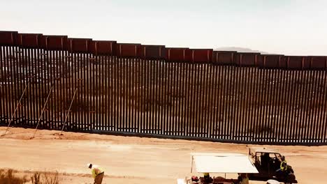 Fly-Over-Of-New-Installed-And-Legacy-Sections-Of-The-Border-Wall-Near-The-Tecate-Port-Of-Entry-In-Tecate-California-June-19-2019