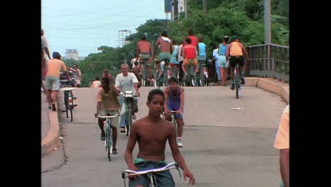 People-ride-bicycles-in-Havana-Cuba-in-the-1980s