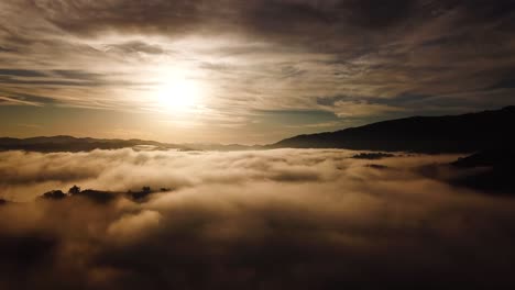 Beautiful-Aerial-Over-A-Foggy-Morning-With-Mountains-And-Clouds-Near-Ojai-California