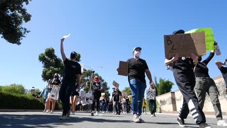 Extreme-Slo-Mo-Marching-Protesters-During-A-Black-Lives-Matter-Blm-March-In-Ventura-California-With-Signs-To-Fund-Schools