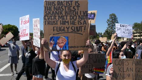 Extreme-Slo-Mo-Protesters-Signs-Says-President-Trump-Is-A-Racist-During-A-Black-Lives-Matter-Blm-March-In-Ventura-California