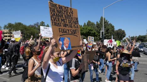 Extreme-Slo-Mo-Protesters-Signs-Says-President-Trump-Is-A-Racist-During-A-Black-Lives-Matter-Blm-March-In-Ventura-California-1