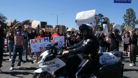 Extreme-Slo-Mo-Motorcycle-Cop-Drives-Past-Protesters-During-A-Black-Lives-Matter-Blm-March-In-Ventura-California