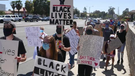 Slow-Motion-Protesters-Chanting-And-Marching-On-Street-With-Protest-Signs-During-A-Black-Lives-Matter-Blm-Parade-In-Ventura-California