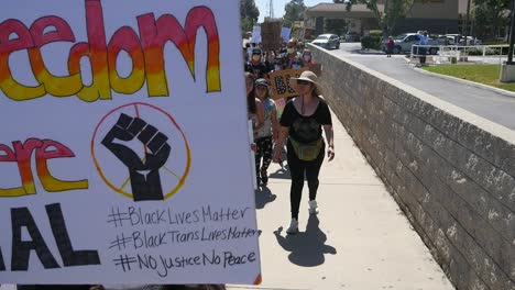 Slow-Motion-Protesters-Chanting-And-Marching-On-Street-With-Protest-Signs-During-A-Black-Lives-Matter-Blm-Parade-In-Ventura-California-1