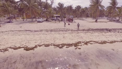 Natives-Do-Cartwheels-On-The-Beach-As-Tourists-Look-On-In-Nassau-The-Bahamas-Caribbean