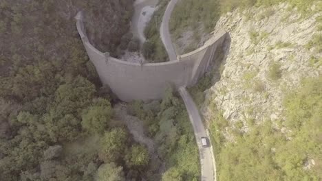 Drone-Aerial-Follows-A-Van-Through-A-Hole-In-The-Controversial-Idbar-Dam-In-Bosnia-1