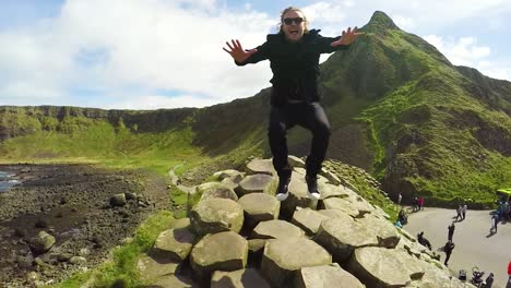 A-Man-Jumps-Up-And-Down-In-Slow-Motion-On-The-Giant\'S-Causeway-In-Ireland