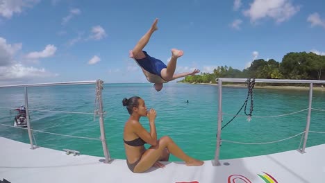 A-Man-Jumps-Off-A-Yacht-Or-Caribbean-Party-Boat-In-Extreme-Slow-Motion