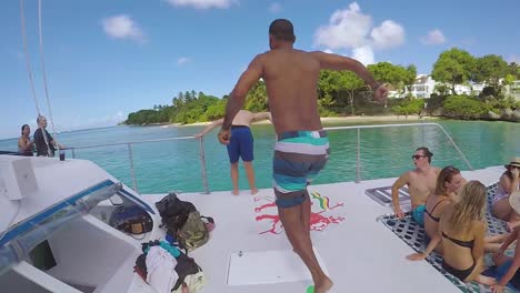 A-Man-Jumps-Off-A-Yacht-Or-Caribbean-Party-Boat-In-Extreme-Slow-Motion-1