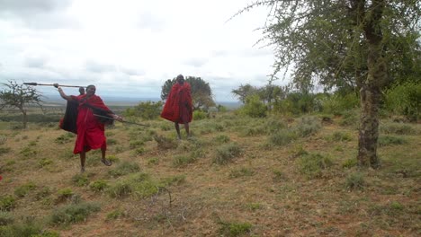 African-Maasai-Warrior-Throwing-Spear-Into-Tree-In-Kenya-East-Africa