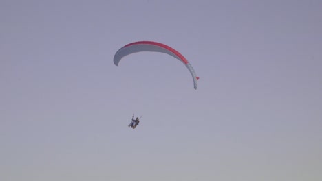 A-Paraglider-Lands-On-A-Snowy-Field-In-Latvia