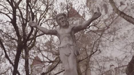 Moving-Shot-Of-A-Lithuanian-Jesus-Christian-Statue-Oustide-A-Cathedral-Church