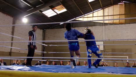 Male-Wrestlers-Fight-In-A-Boxing-Ring-In-Bolivia