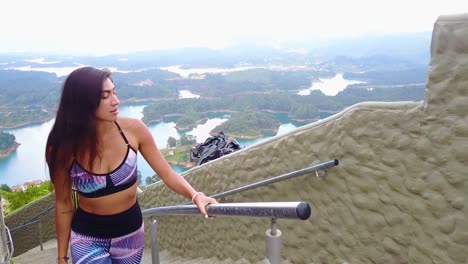 A-Beautiful-Woman-Walks-Up-A-Stairway-On-A-Mountainside-In-Guatepe-Colombia