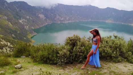 A-Beautiful-Woman-Walks-Along-The-Rim-Of-A-Volcano-And-Cone-At-Quilotoa-Ecuador