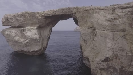 Aerial-Shot-Around-The-Now-Collapsed-Azure-Window-Rock-Formation-On-The-Island-Of-Gozo-In-Malta