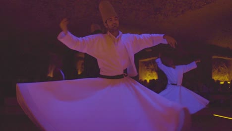 Whirling-Dervishes-Spin-In-A-Trance-In-A-Darkened-Mosque-In-Turkey