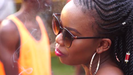 An-African-Woman-Dances-And-Smokes-In-Slow-Motion-At-A-Festival-In-Uganda