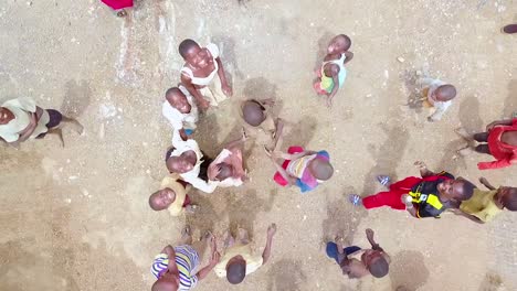 Aerial-Over-African-Children-Playing-And-Jumping-Up-And-Down