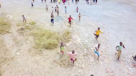 Aerial-Over-African-Children-Running-Playing-And-Jumping-Up-And-Down