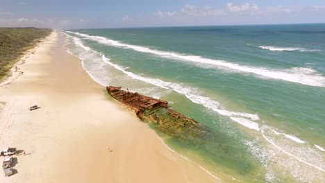 An-old-shipwreck-is-seen-washed-up-on-a-beach-of-Fraser-Island-off-the-coast-of-Queensland-Australia