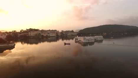The-Taj-Lake-Palace-on-Lake-Pichola-in-Udaipur-India-is-seen-at-sunset