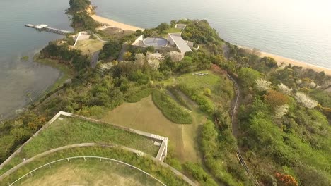 An-aerial-view-shows-the-Benesse-House-and-the-coastline-of-Naoshima-Island-in-Japan