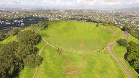 An-aerial-view-shows-tourists-visiting-Maungawhau-the-volcanic-peak-of-Mount-Eden-in-Auckland-New-Zealand