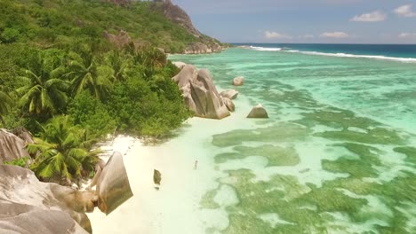 An-aerial-view-shows-tourists-enjoying-the-beach-on-the-La-Digue-Island-in-the-Seychelles