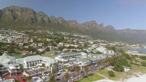 An-aerial-view-shows-beaches-and-mountains-of-Camps-Bay-in-Cape-Town-South-Africa