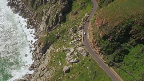 A-bird'seyeview-shows-cars-are-seen-driving-by-the-seaside-along-Chapman's-Peak-in-South-Africa