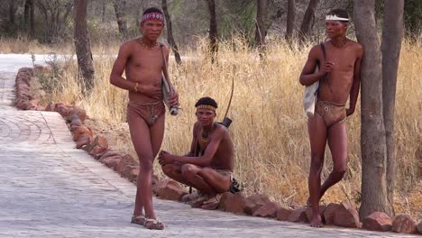 San-tribal-African-men-sit-in-the-bush-near-their-village-2
