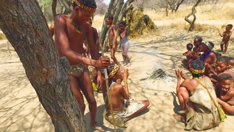African-San-tribal-bushmen-perform-a-fire-dance-in-a-small-primitive-village-in-Namibia-Africa-1