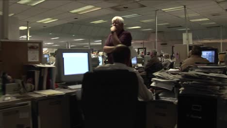 A-point-of-view-shot-walking-through-a-newsroom
