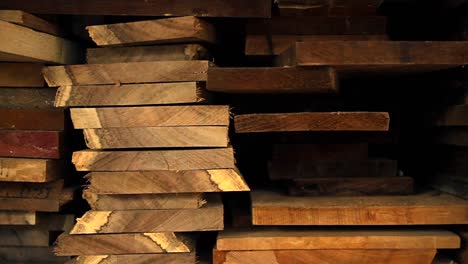 Planks-of-wood-and-lumber-are-stacked-vertically