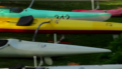 Empty-kayaks-sit-on-a-beach