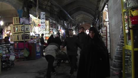 A-shoppers-pass-through-a-bazaar-in-Iran-1