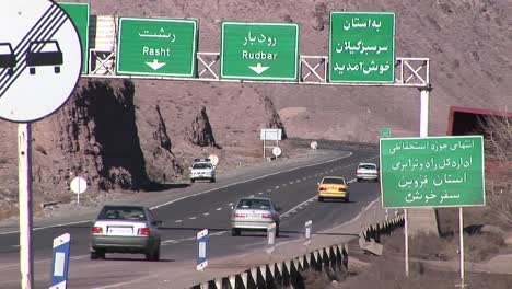 Cars-pass-along-a-highway-in-Iran