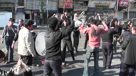 Protesters-march-down-a-busy-street-in-Iran